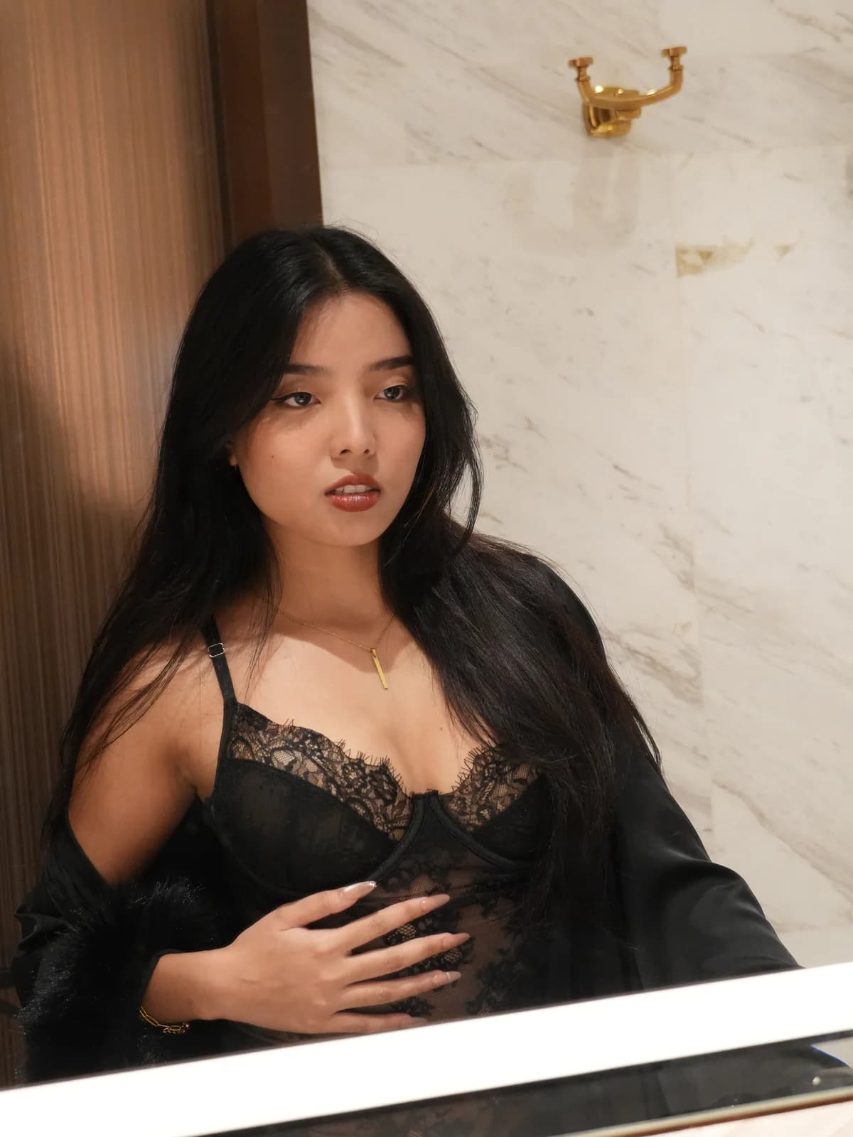 Merchant campaign preview: model in a black lace chemise with a sheer robe
