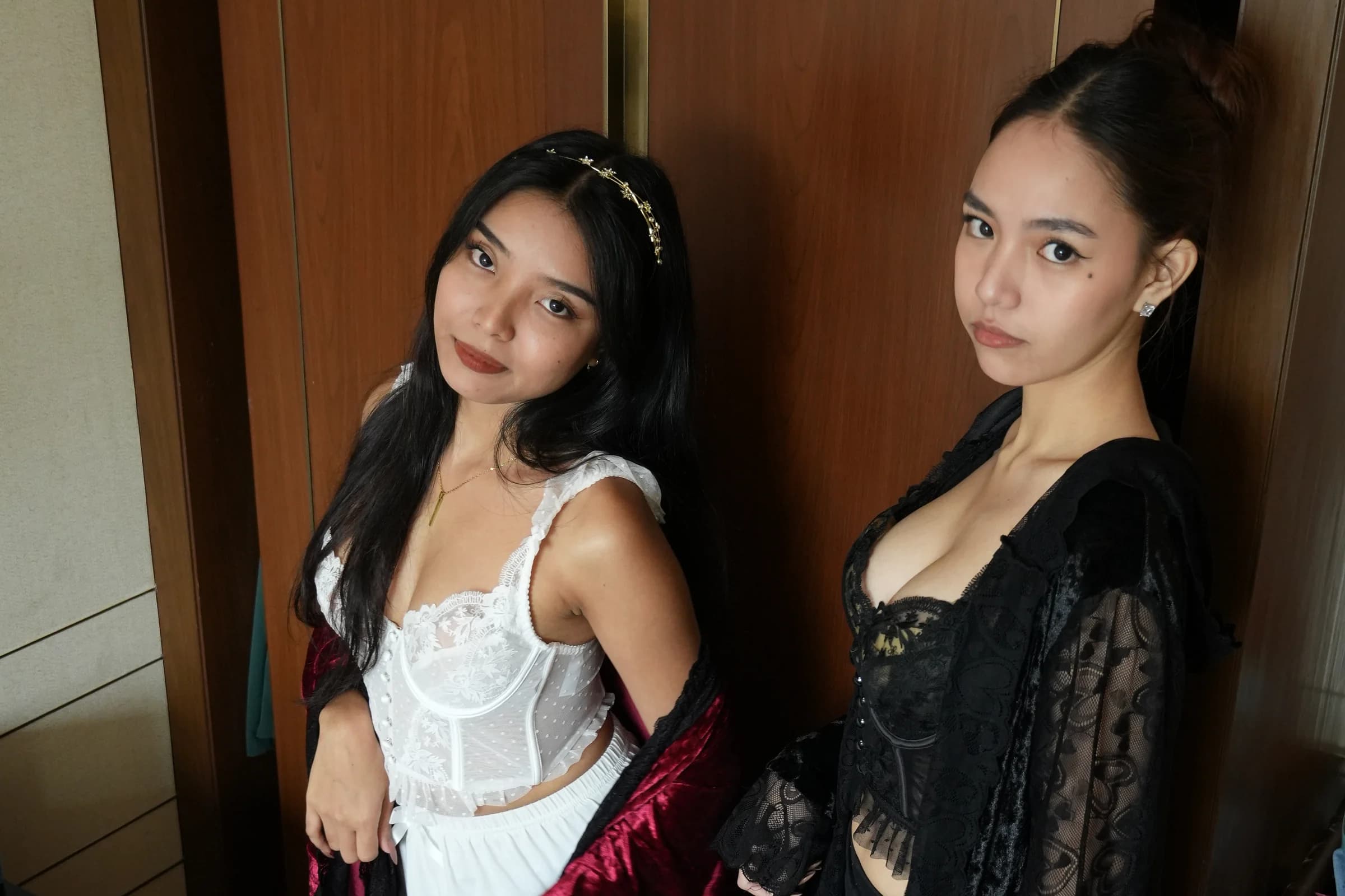 Editorial campaign scene with two models in contrasting velvet robes