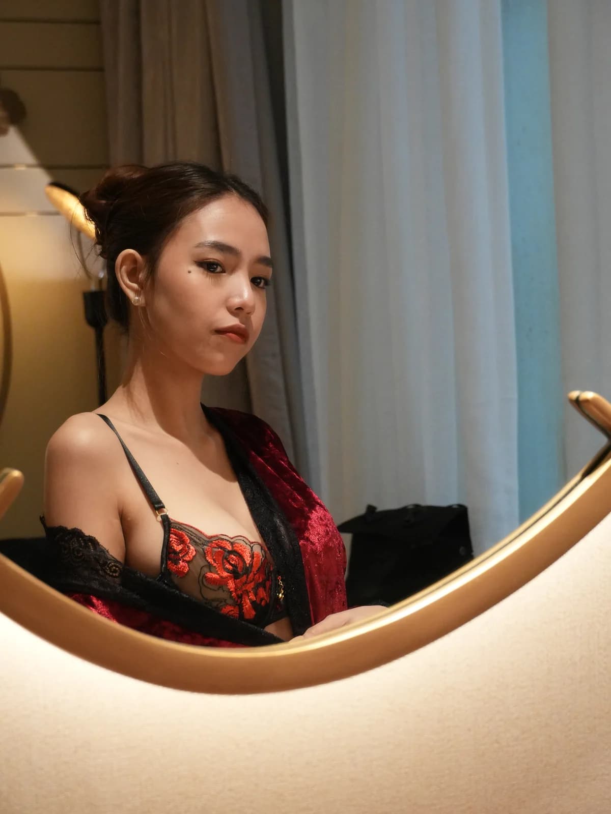 Merchant campaign preview detail: black lace, red floral embroidery, and satin