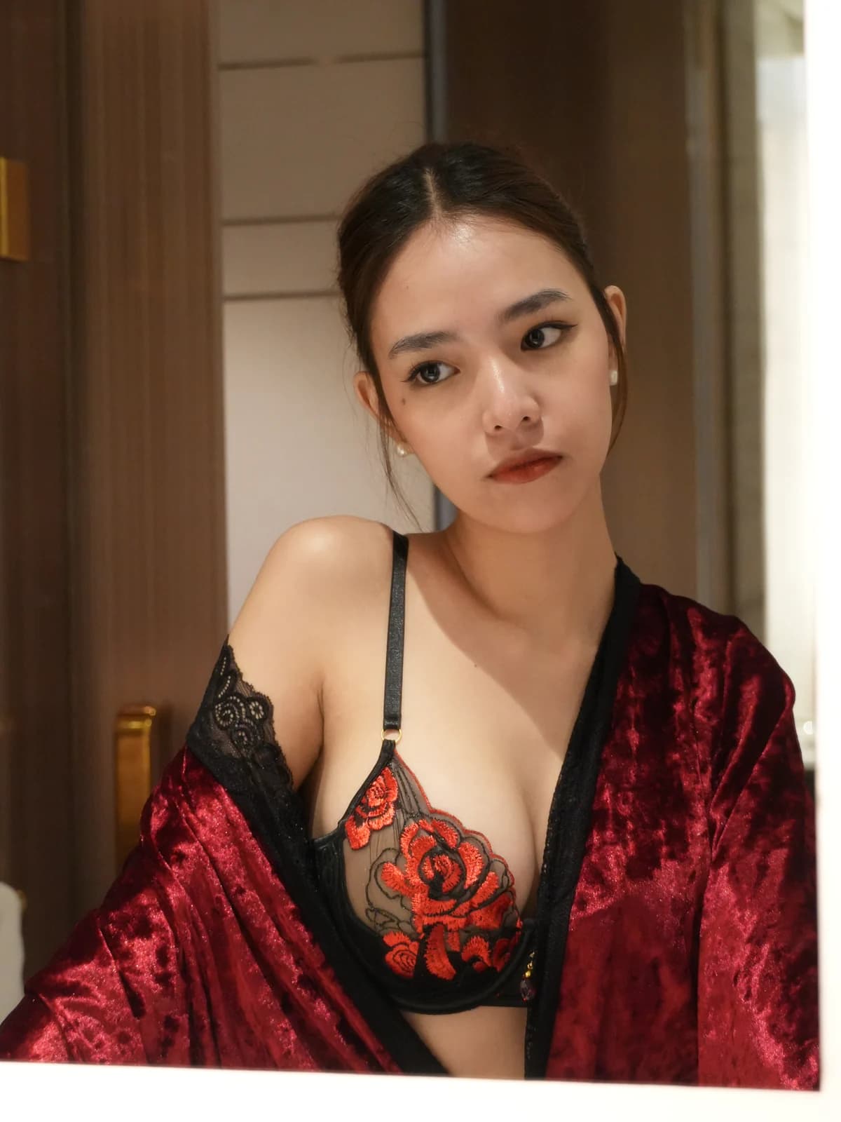 Merchant campaign preview: model in a black lace set with a red floral robe