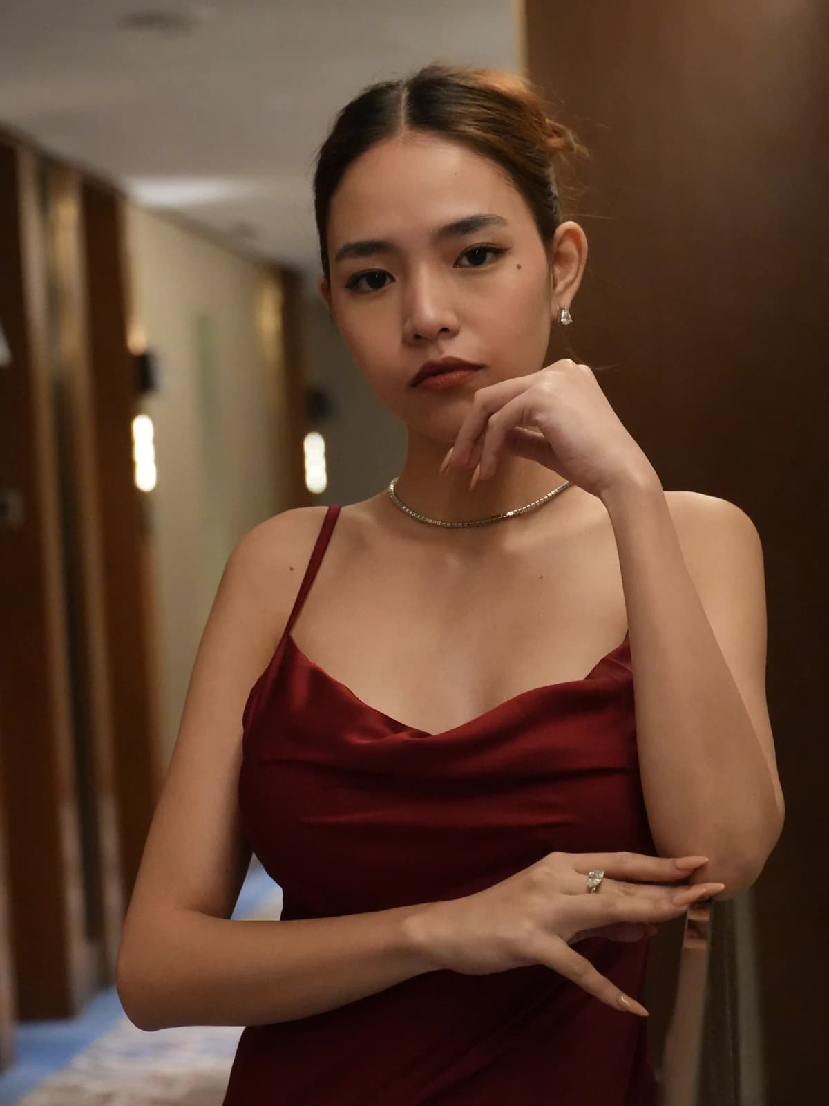 Merchant campaign preview detail: burgundy satin and a draped neckline