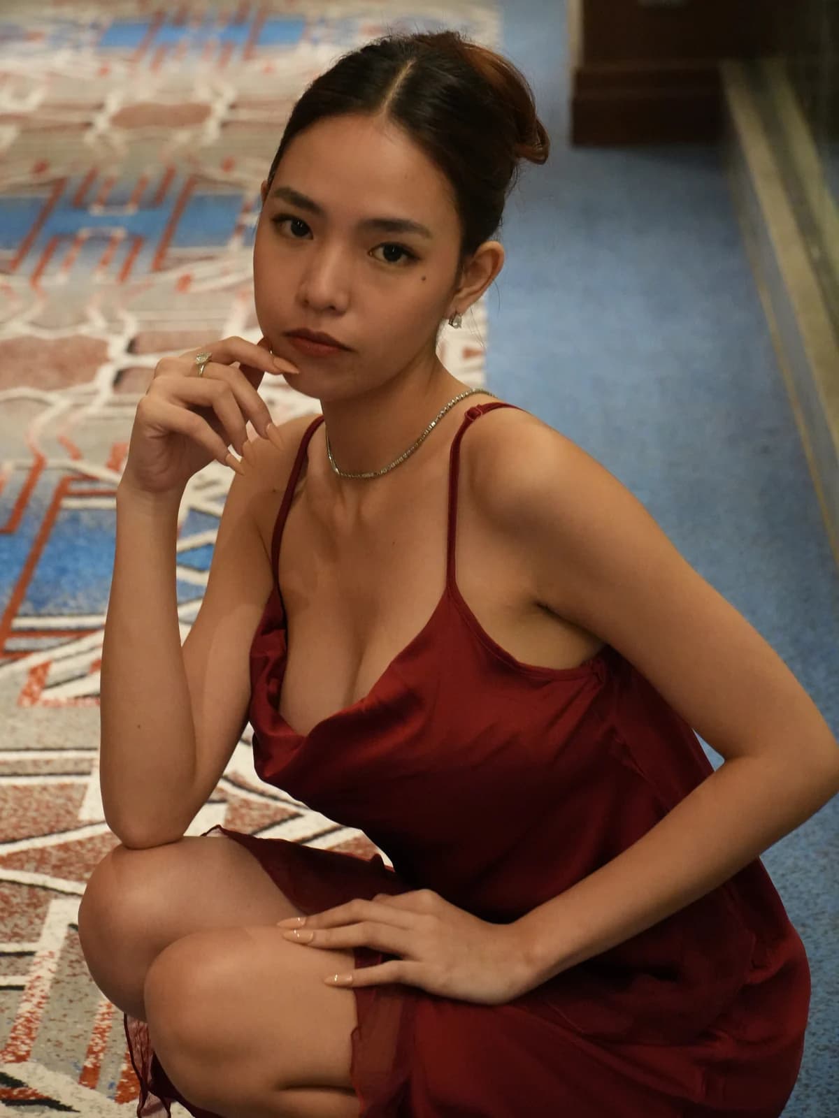 Merchant campaign preview: model in a burgundy satin cowl chemise