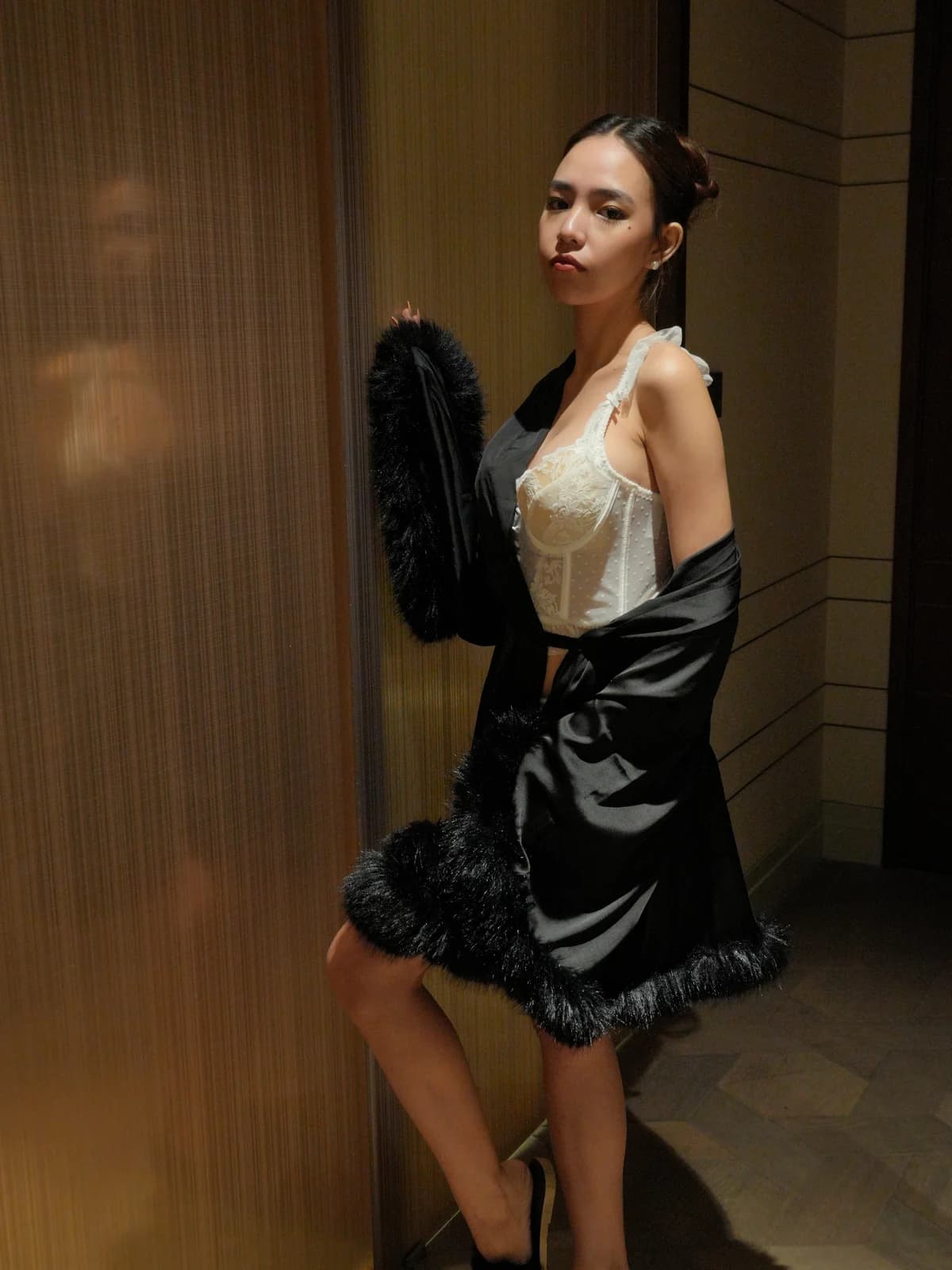 Merchant campaign preview: model in an ivory structured lace set with a black satin robe